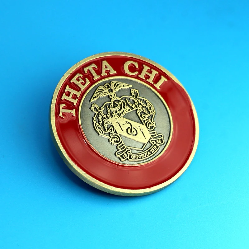 Multiple custom eagle challenge coins laid out with different plating finishes