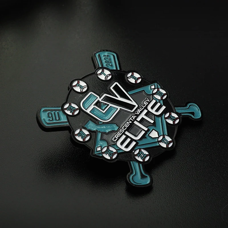 Side view of black metal trading pin with engraved team name and season year, showing depth of enamel fill