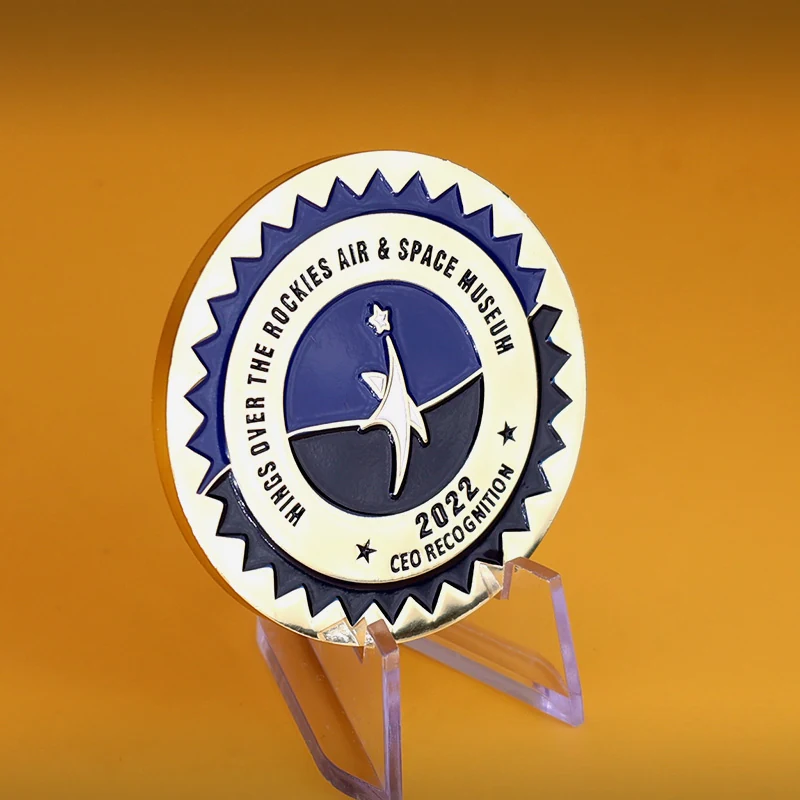 Close up of soft enamel fill and raised relief on a custom gold challenge coin