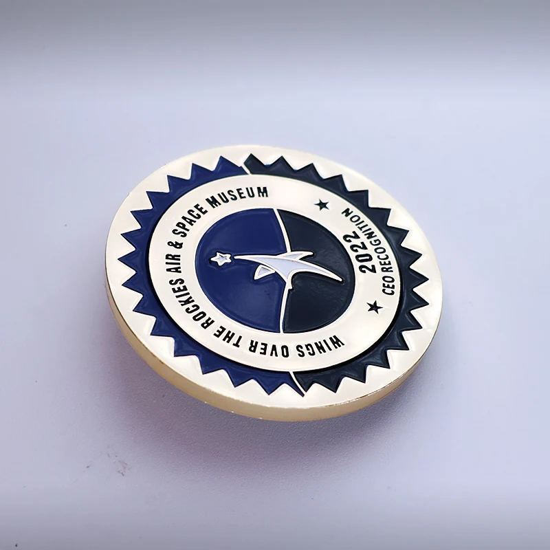 Custom gold challenge coin with red and blue enamel, die struck with unit insignia and polished gold finish