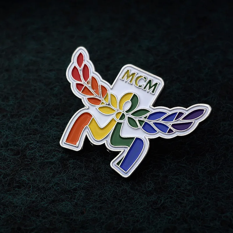 Lapel pin worn on a lapel with a dark suit, showing the full design and finish