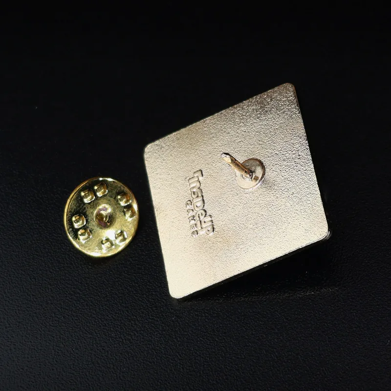 Multiple custom enamel lapel pins laid out with different colour schemes and finishes