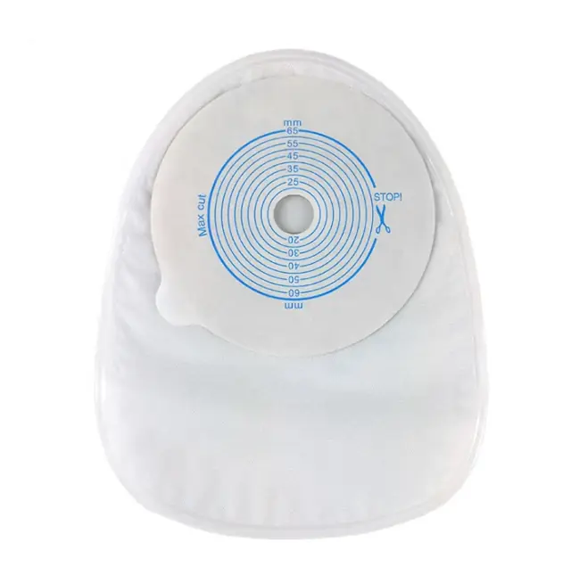 Ostomy bag with activated carbon filter and adhesive base plate