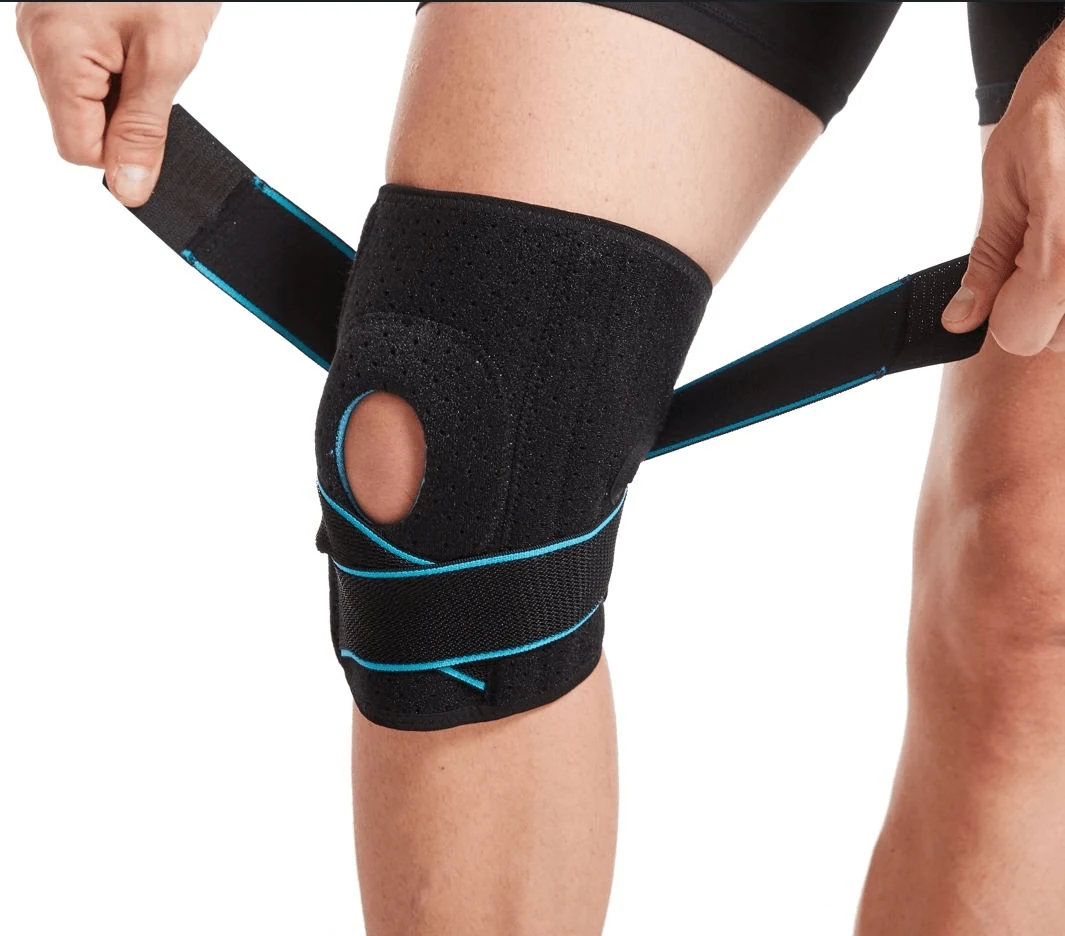 Knee brace with patellar opening for joint support