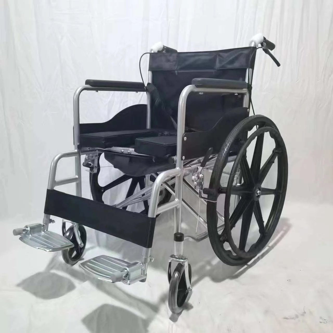 Manual wheelchair side view showing seat and rear wheel