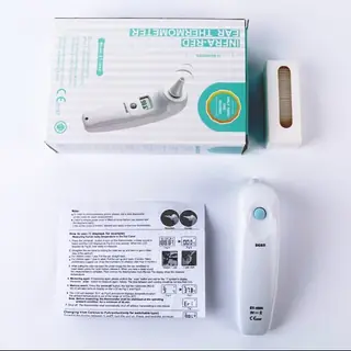 Far infrared thermometer held for a temperature reading