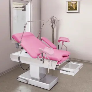 Gynaecological examining table with drainage basin pulled out