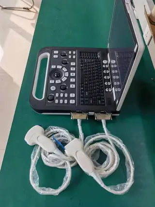 Ultrasound system interface ports on the laptop body