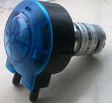 Three peristaltic tube pump heads in blue grey and amber housings