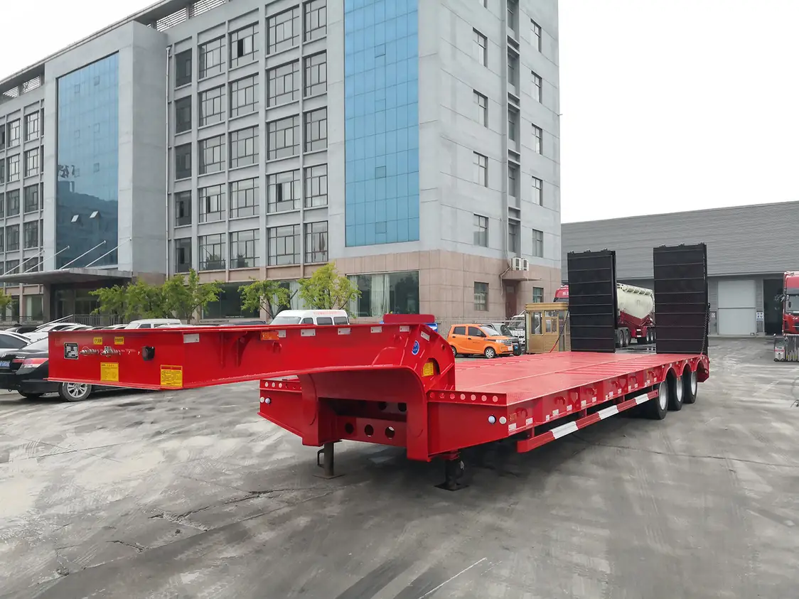 SINOHENG low bed semi trailer with hydraulic ramps inside the Liangshan assembly workshop
