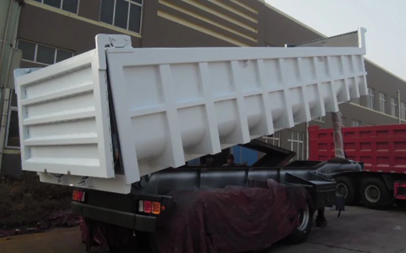 SINOHENG rear flip tipper semi-trailer with body raised for discharge view 4