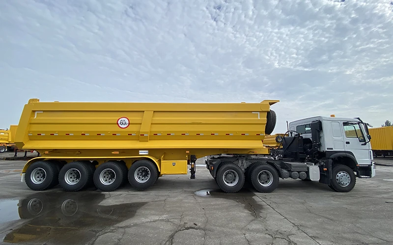 SINOHENG rear dump semi-trailer coupled to a Sinotruk HOWO prime mover view 2