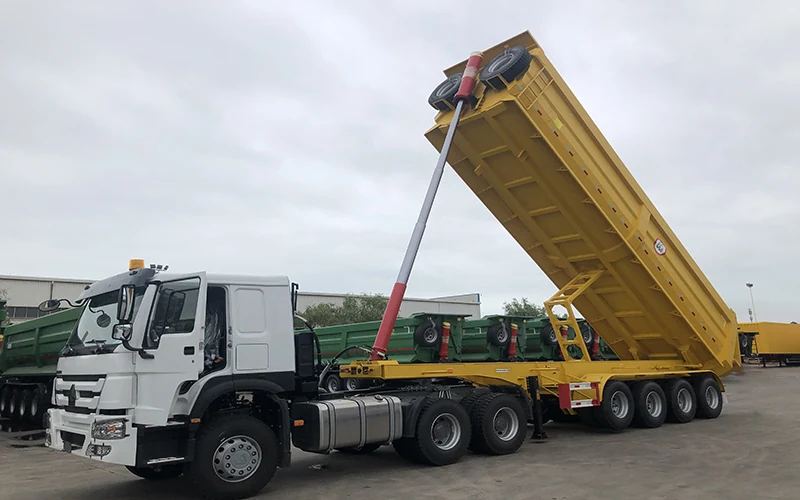 SINOHENG rear dump semi-trailer coupled to a Sinotruk HOWO prime mover