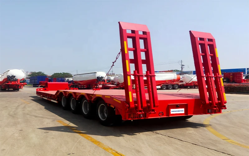 SINOHENG four-axle low bed semi-trailer carrying heavy machinery