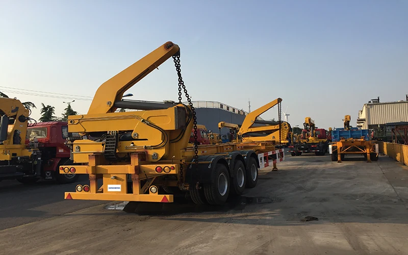 SINOHENG container side loader semi-trailer lifting a shipping container from the ground view 3