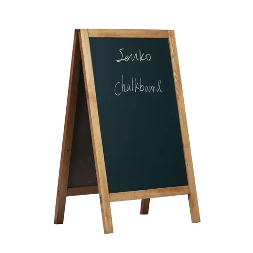 A frame wooden blackboard standing open with chalk writing on the black panel
