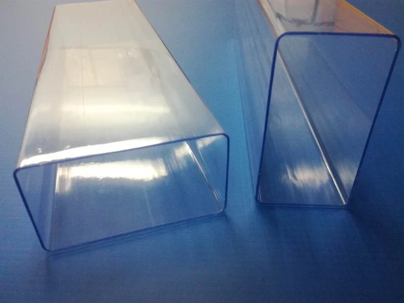 Two clear rectangular acrylic tubes resting
