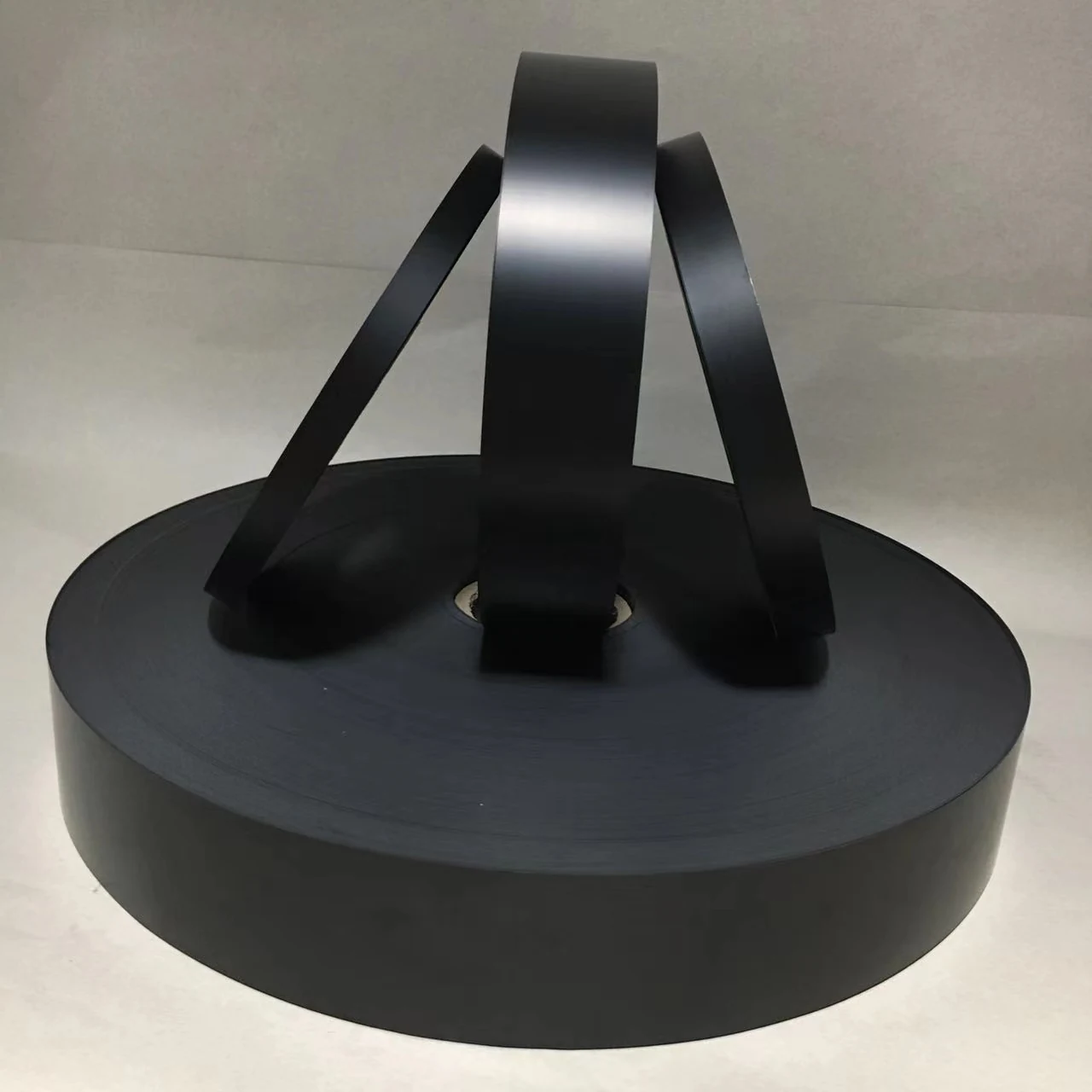 Black carrier tape sheets with embossed pockets on a production line