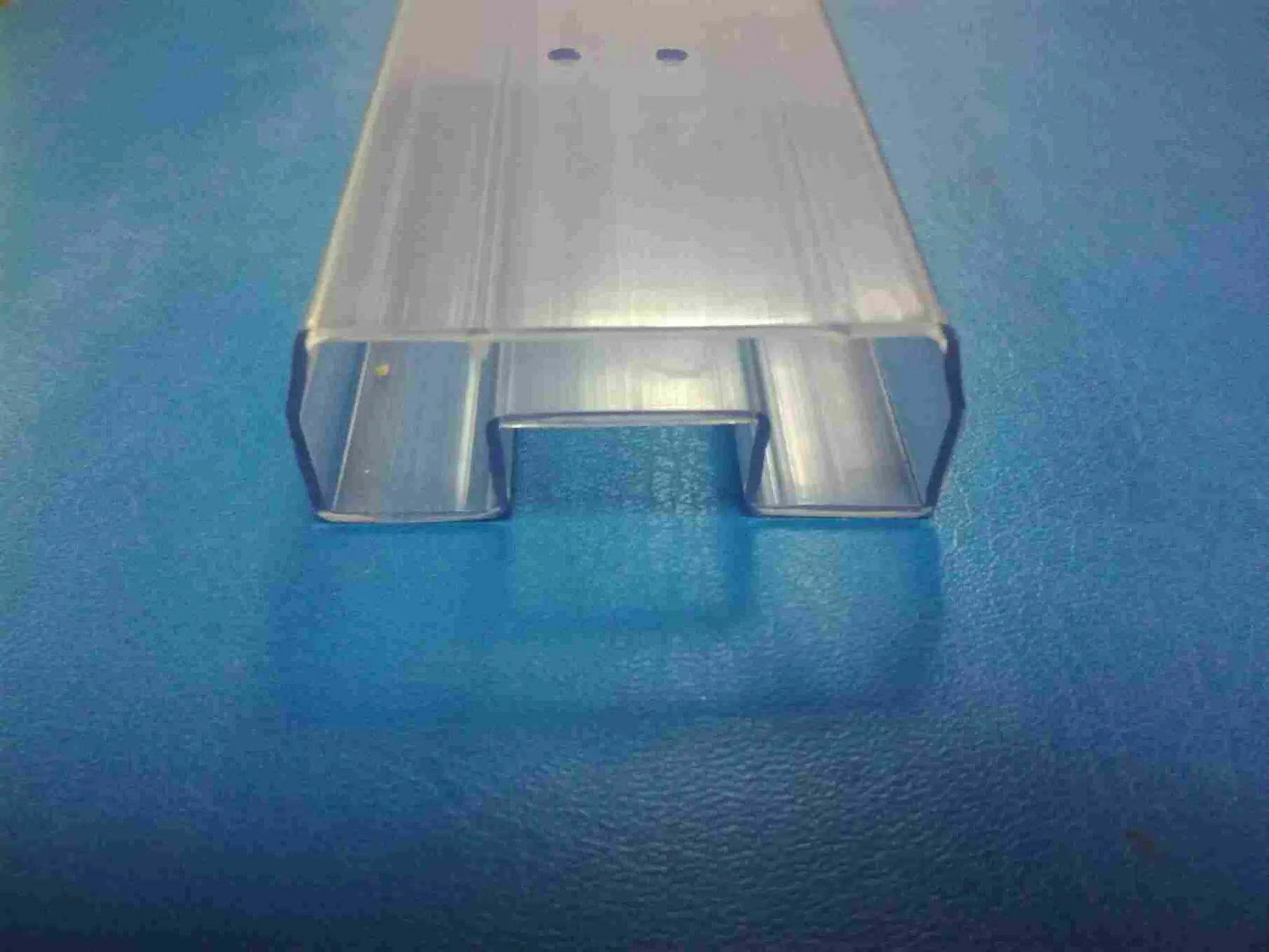 Blue and transparent DIP tubes filled with through-hole ICs and relays