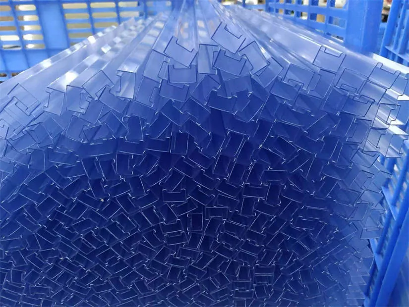 Stacked translucent blue plastic profiles packed tightly