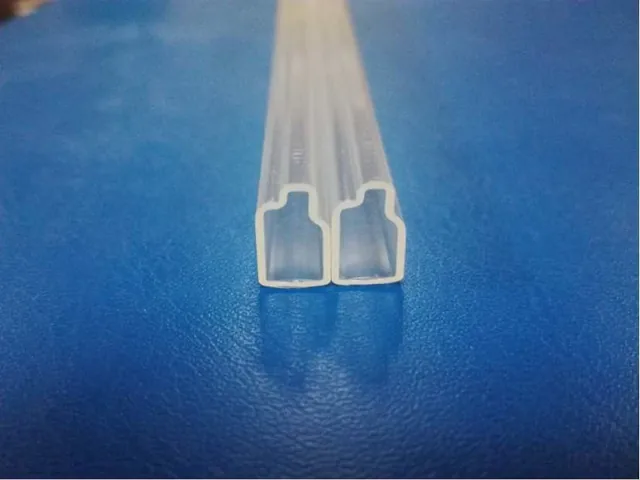 Transparent small relay shipping tubes filled with relays and switches stacked in bundles