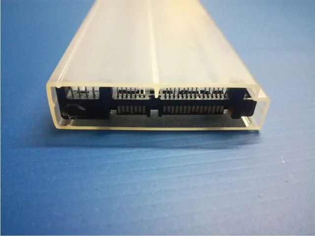 Blue and red ESD tubes filled with electronic components