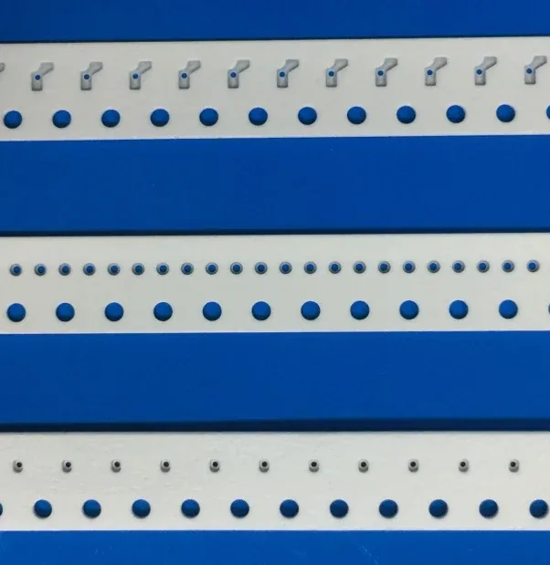 Pre-punched paper carrier tape with round center cavity showing the central hole and pocket structure
