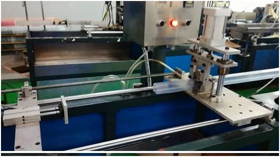 Industrial machinery featuring linear rails, pneumatic actuators, and a blue frame
