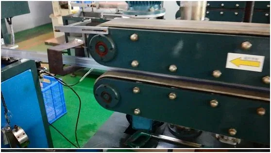 Green industrial machine with a yellow arrow sticker