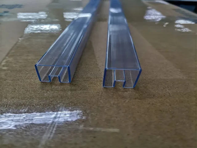 Close-up of an anti-static IC tube profile showing internal channel and wall thickness