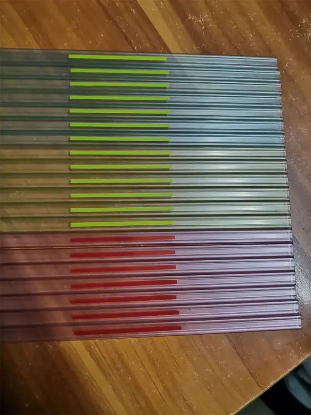 Transparent and colored IC tubes stacked in bundles ready for packing