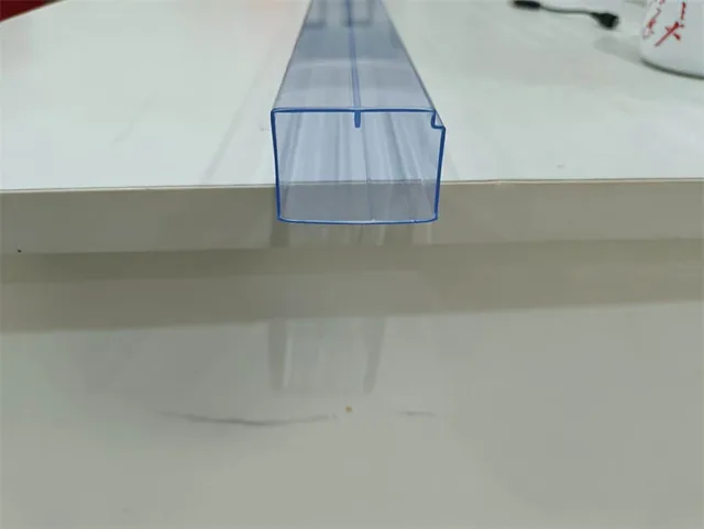 Close-up of a custom tube profile showing internal channel matched to a device body
