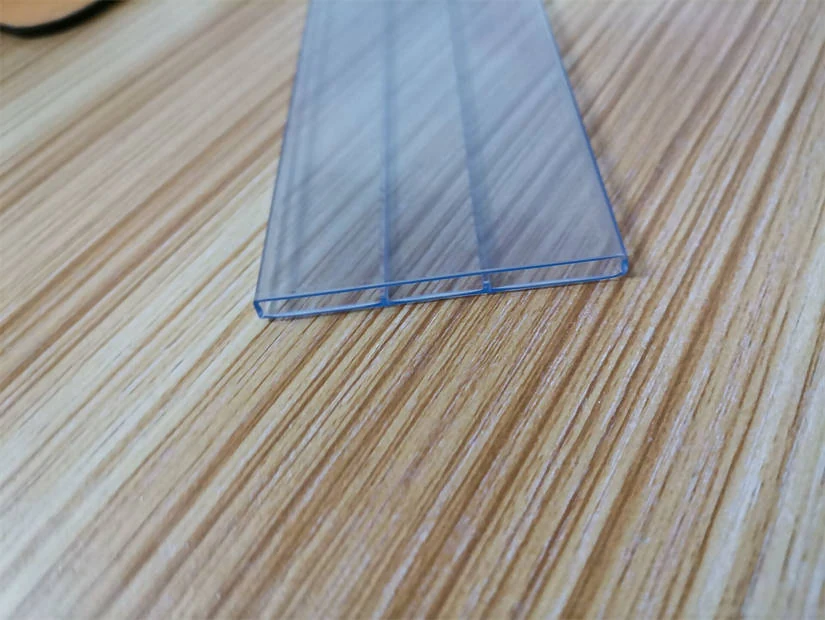 Close-up of an anti-static IC tube profile showing internal channel and smooth surface