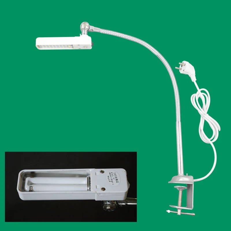 AOM 96TS sewing machine light tube mounted on a sewing machine table with dual voltage input