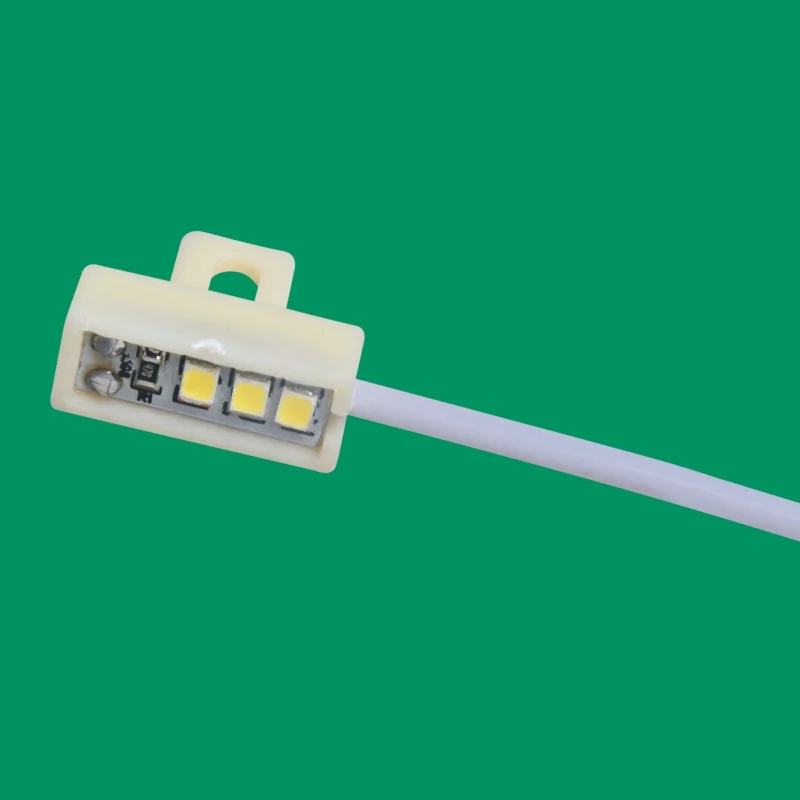 AOM-1A sewing machine accessory light mounted on an overlock machine with strong magnet base
