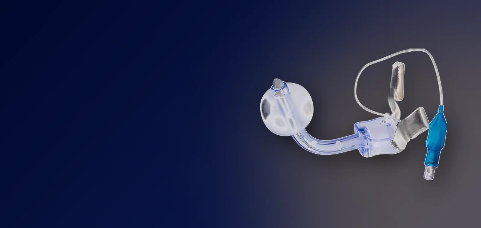 Cuffed tracheostomy tube with indicator balloon and fixed wing