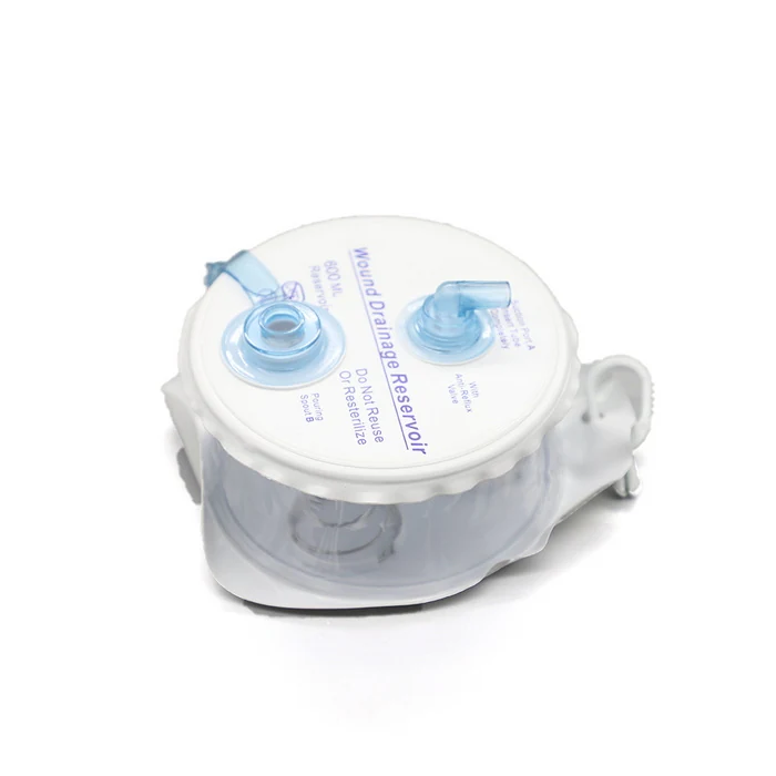 Closed wound drainage system with spring evacuator reservoir and trocar drain