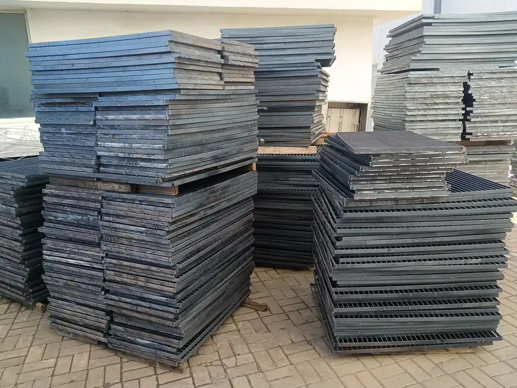 Large stacks of hot-dip galvanized welded steel grating panels ready for despatch