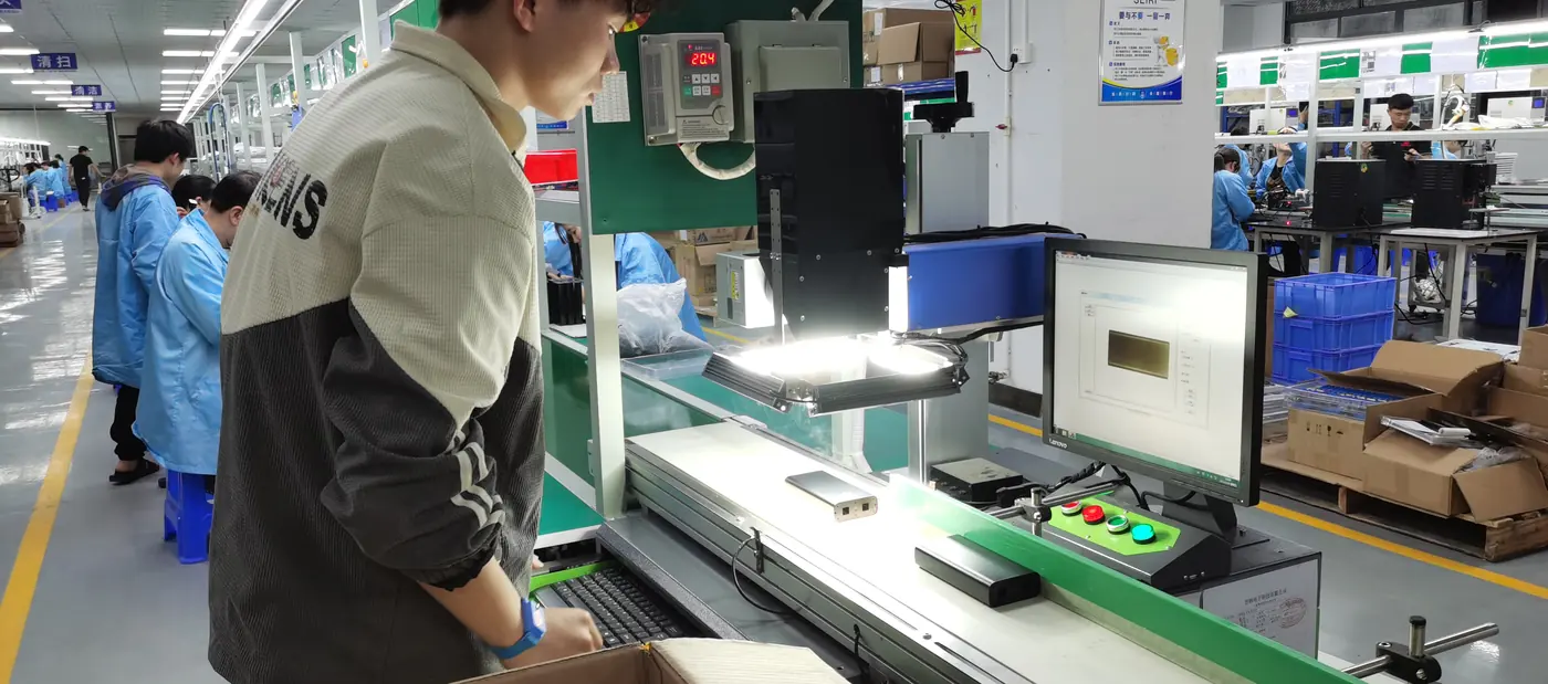 Visual capture laser engraving station at the Shinetech factory