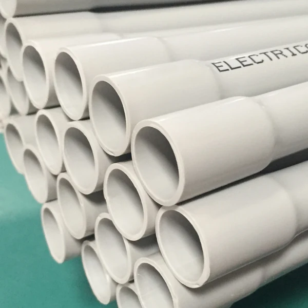 Stack of white rigid PVC electrical conduit with socketed ends