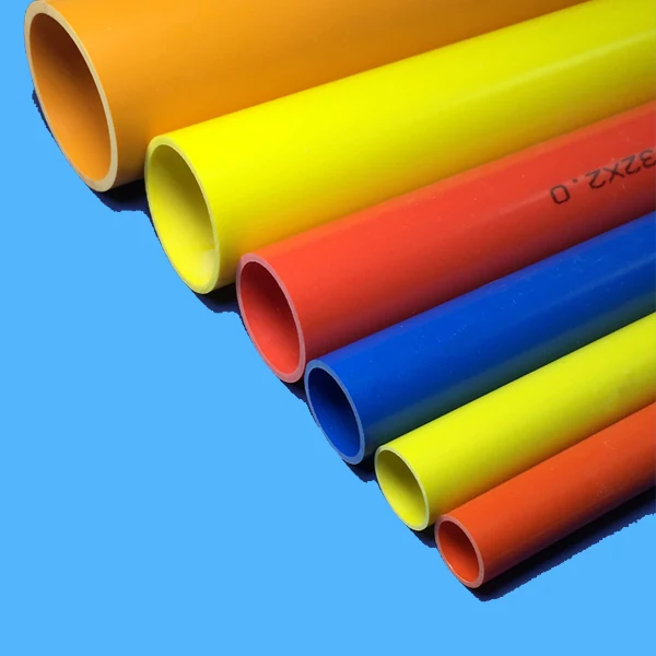 Orange PVC conduit in large diameters stacked on a blue surface