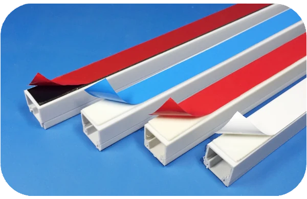 Double sided adhesive tape being peeled from PVC trunking backing