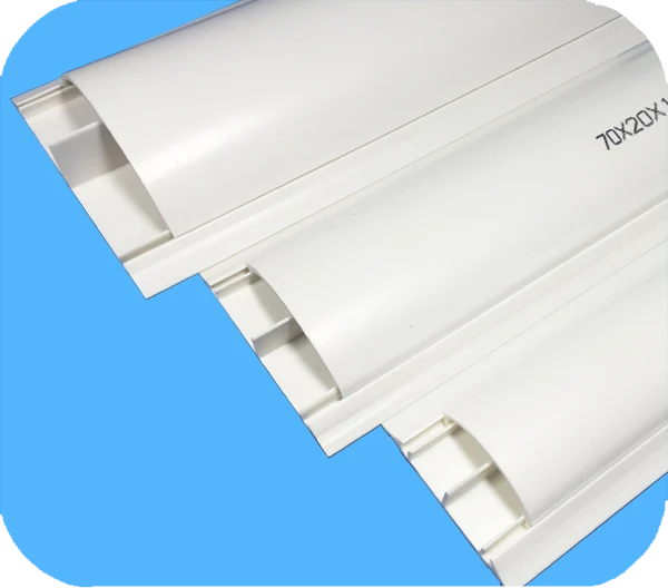 Arc profile PVC floor trunking lengths stacked on a blue background