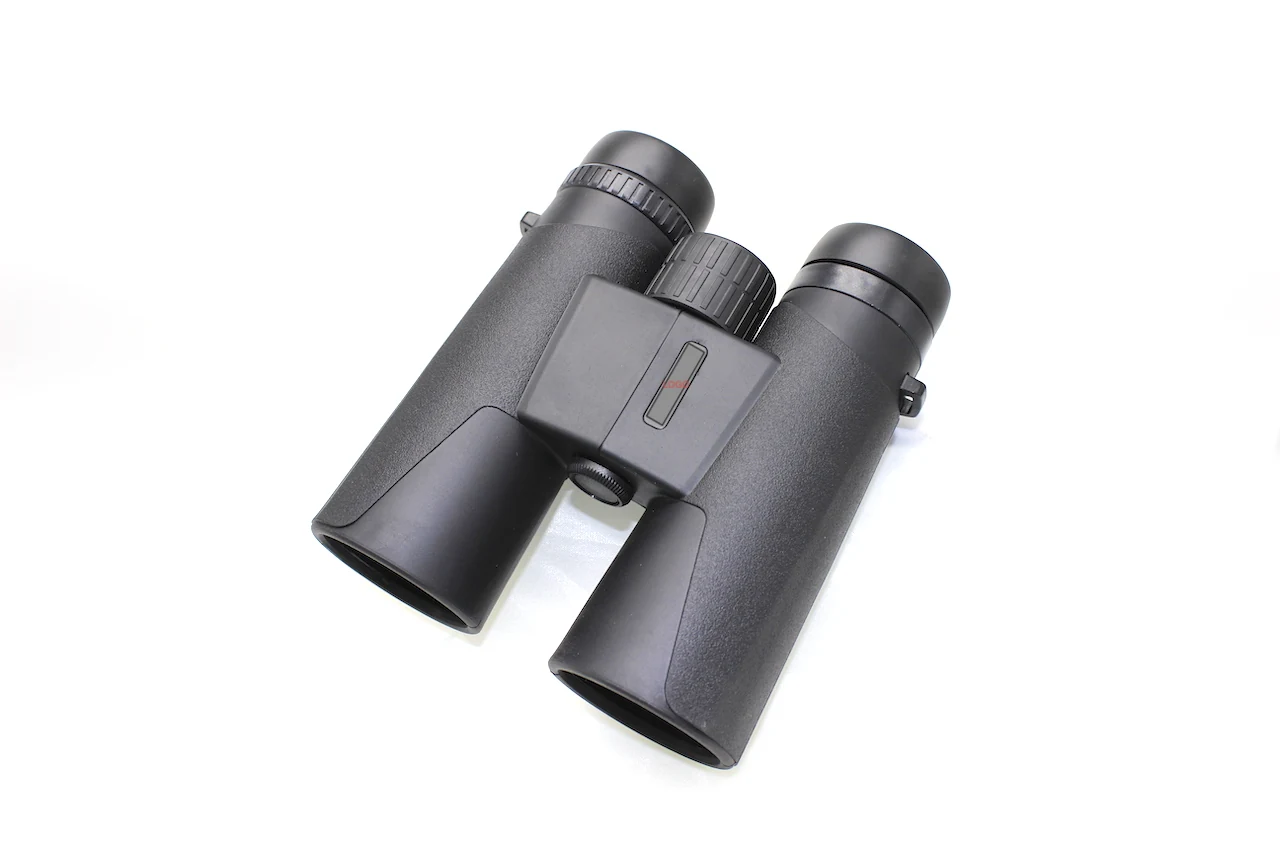 Black compact binoculars on a white background