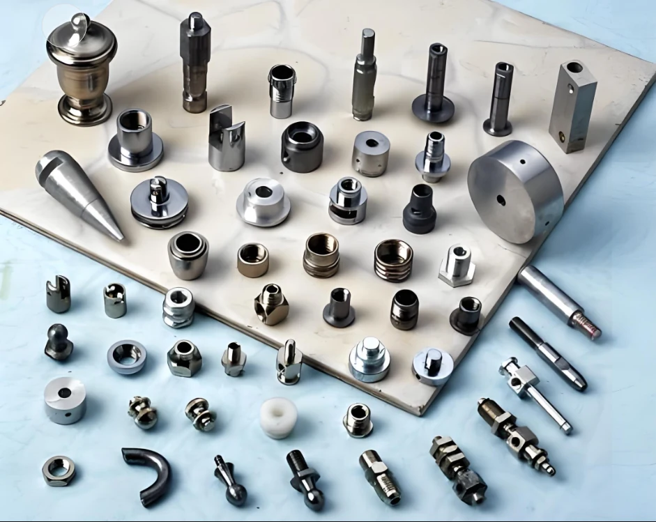 Board of turned steel and brass components produced at the Shipu Precision workshop