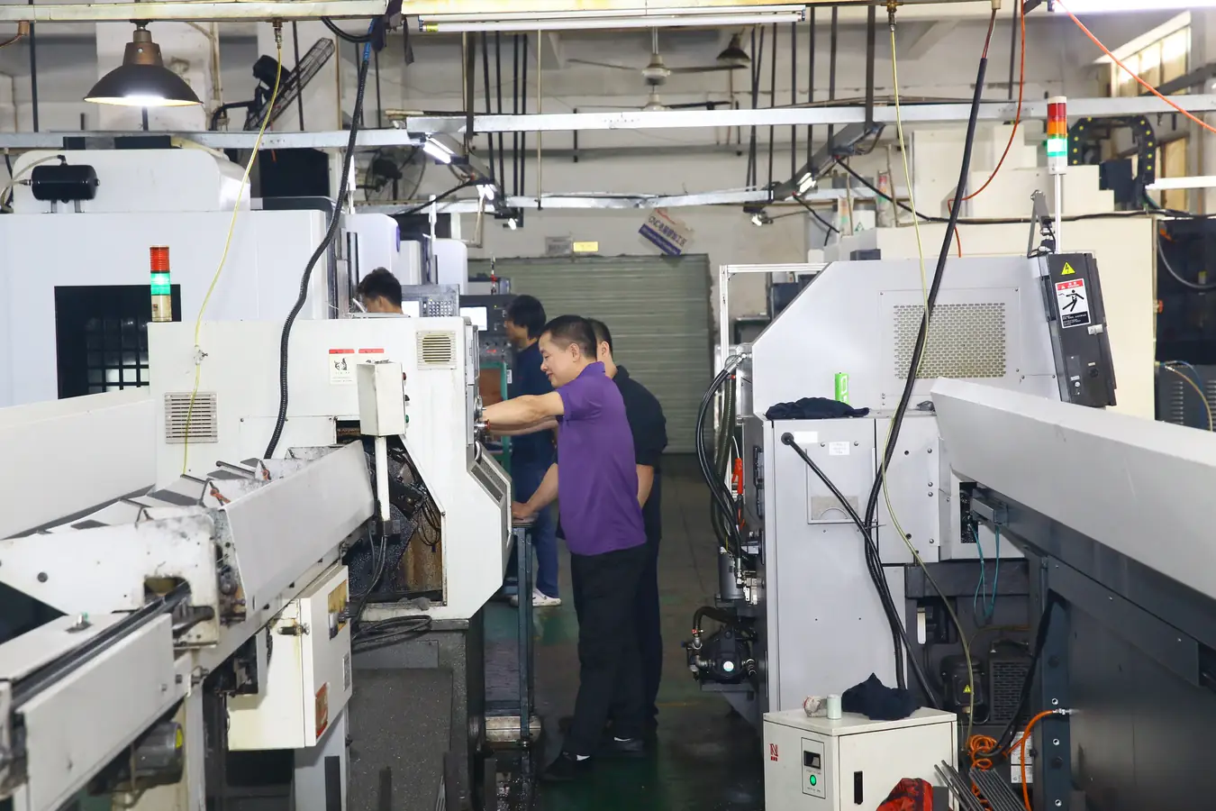 Machine operator at work in the Shipu Precision plant in Shenzhen