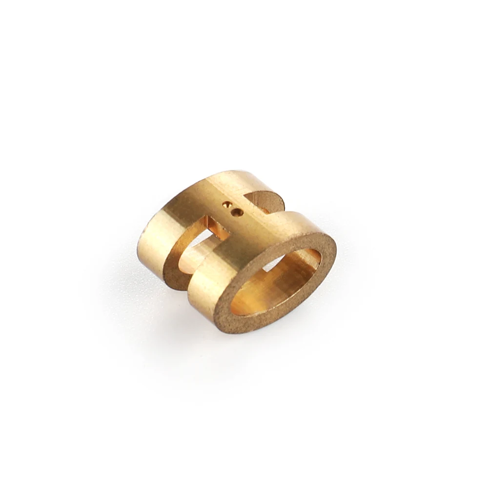 Brass machined coupling block with a through bore and milled slots