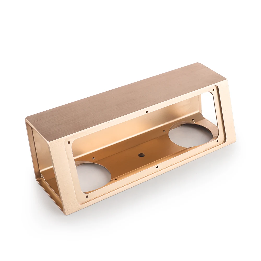 Machined box frame housing with open window and mounting bosses