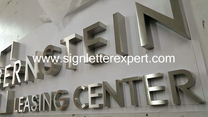 Brushed stainless steel lettering signs