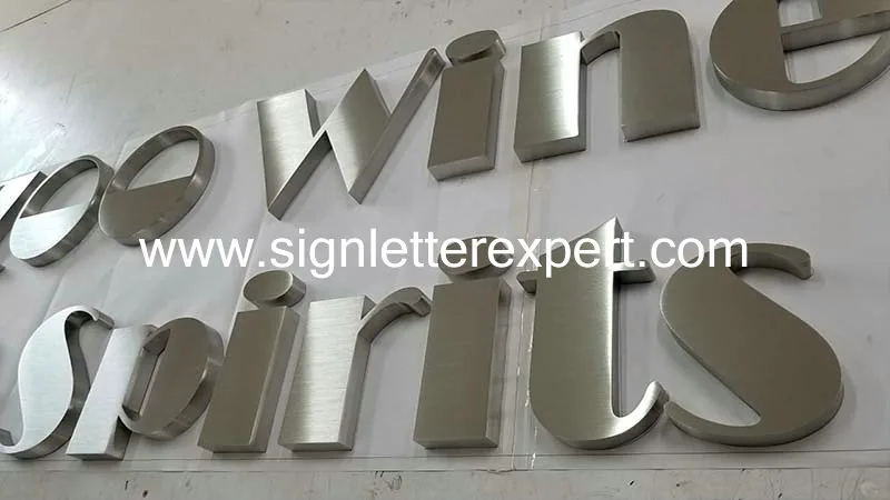 Brushed stainless steel lettering signs